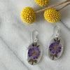 Alpaca Silver Oval with Purple Pressed Flower Dangle Earrings